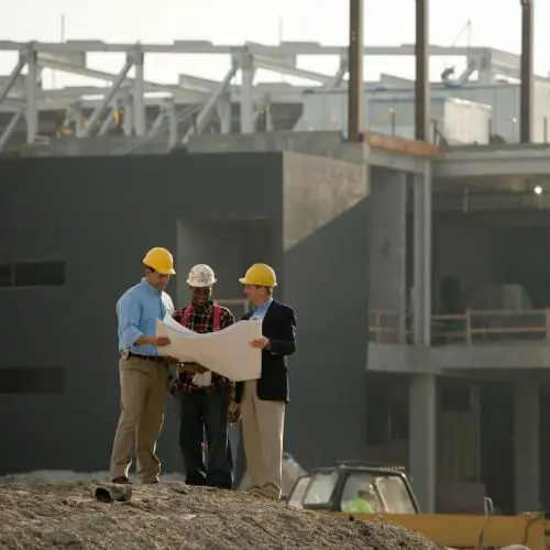 Engineers on a hill planning